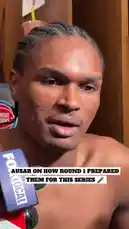 A shirtless NBA player gives a post-game interview in a locker room setting. He speaks into multiple microphones, including one from FOX Sports, discussing the physicality of the current playoff series and how his team was better prepared due to experience gained in a previous matchup. The atmosphere suggests a candid moment after a challenging game. by @nba with Original Sound by nba