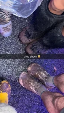 A first-person perspective captures a group of hikers navigating a wet trail. The camera focuses on their muddy boots and waterproof pants, highlighting the rugged conditions. A voice points out something of interest ahead, suggesting an exciting discovery during their outdoor journey. by @snapcreators with Original Sound by snapcreators