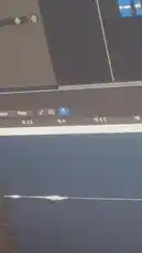 This video provides a behind-the-scenes look at music production using digital audio workstation software. The camera focuses on a computer screen displaying a timeline with multiple tracks and audio clips, illustrating the process of arranging and editing music. by @nascarfeezy with Original Sound by nascarfeezy