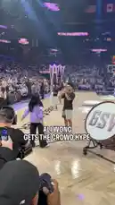 In a lively moment from a Golden State Warriors game, comedian Ali Wong joins the team's cheerleaders on the court. She dances enthusiastically alongside them, clearly enjoying the energy of the packed arena. The crowd cheers loudly as she interacts with the performers, creating a fun and memorable scene. by @wnba with Original Sound by wnba