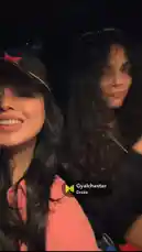 In a dimly lit car at night, a woman with long dark hair, wearing a pink top and a black baseball cap with a red star, smiles and poses for the camera. She adjusts her hat and leans back, showcasing denim shorts. The song 'Gyalchester' by Drake plays in the background, creating a relaxed, late-night atmosphere. by @e-beth with Gyalchester by Drake
