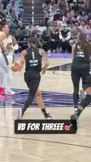 In a pivotal moment of the game, Sabrina Ionescu (#22) receives a pass at the top of the key, calmly steps back, and drains a deep three-pointer to silence the opposing team's bench. Her teammates rush to celebrate with her as the crowd erupts in cheers, capturing the electric atmosphere of a high-stakes WNBA matchup. by @wnba with Original Sound by wnba