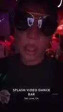 tufavlatiino 님이 만든 Original Sound 포함 @tufavlatiino 님이 만든 This first-person perspective video takes you inside Splash Video Dance Bar in San Jose, CA. The scene is set with vibrant red and purple lighting, creating an energetic nightlife atmosphere. A person wearing sunglasses is featured prominently, capturing the lively ambiance of the venue. The text overlay clearly identifies the location, immersing viewers in the experience.