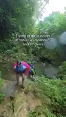 In this comedic outdoor adventure, Jayify and friends attempt to navigate a muddy jungle path while carrying inflatable rings, embodying the struggles of 'alcoholics and smokers' trying to enjoy nature. The scene captures their humorous efforts to maintain balance and composure amidst the challenging terrain. by @jayify5 with Original Sound by Contains: RUN, RUN, RUN - Dj Molko
