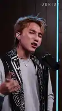 Watch Vietnamese pop sensation Son Tung M-TP deliver a powerful live performance of his hit song 'Come My Way'. This open mic session captures him singing passionately into a microphone, showcasing his vocal talent and stage presence against a modern backdrop with striking blue neon lights. by @geniusverified with Original Sound by geniusverified