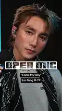Watch Vietnamese pop sensation Son Tung M-TP deliver a powerful live performance of his hit song 'Come My Way'. This open mic session captures him singing passionately into a microphone, showcasing his vocal talent and stage presence against a modern backdrop with striking blue neon lights. by @geniusverified with Original Sound by geniusverified