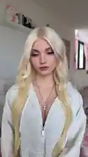 Get an intimate look at Chloe's personal style and beauty routine in this candid, behind-the-scenes moment. She showcases her signature long blonde hair, striking makeup, and cozy yet chic outfit, offering fans a glimpse into her everyday aesthetic. by @lmao with Original Sound by lmao