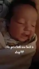 A close-up shot captures a baby's wide-eyed, curious expression as they react to something off-camera. The intimate, dimly lit scene highlights the baby's innocent wonder, creating a heartwarming moment. by @alonamia22 with Original Sound by alonamia22