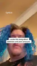 In a raw, self-shot performance, musician TALK passionately sings lyrics about addiction and peer pressure. With vibrant blue hair and intense facial expressions, they deliver lines like 'Time and time the trains pass by going CHOO CHOO CHOO' and 'Oh the train keeps comin' the train keeps comin for you you'. The energetic, close-up shot captures the emotional weight of their original song. by @iamtalk with iamtalk by Original Sound