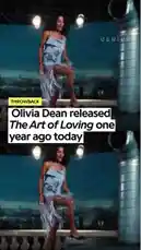 This video is a nostalgic look back at Olivia Dean's music video for her song 'The Art of Loving,' released one year ago today. It features a split-screen montage of scenes from the video, including intimate moments between Olivia and a man in a dimly lit room, and vibrant rooftop dance sequences against a city skyline at night. The accompanying audio is the full track from the music video. by @geniusverified with Original Sound by Contains: Man I Need - Olivia Dean