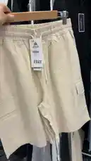 Watch as كود اناقتي showcases a pair of beige cargo shorts from the brand STELLUTO. This close-up look highlights the drawstring waist, side pockets, and relaxed fit, perfect for casual summer wear. See how to style these versatile shorts for a trendy everyday look. by @code.a3 with original sound