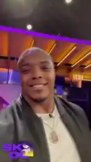 A close-up shot captures a Minnesota Vikings player speaking directly to the camera in a modern studio setting. As he talks, a fan's impressive beatboxing performance plays in the background, creating a dynamic and engaging interaction. by @vikings with original sound
