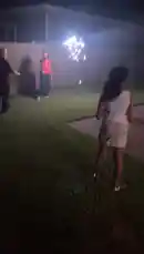 A group of people enjoy using sparklers in their backyard at night. One person swings a long sparkler, creating bright trails of light against the dark sky. by @marcus.randall with Original Sound by marcus.randall
