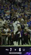 A dynamic sequence from a Baltimore Ravens football game shows a key player in action during the first quarter. The player, wearing jersey number 8, catches a pass and sprints down the field, evading defenders before scoring a touchdown. The crowd erupts in cheers as teammates celebrate the successful play. This thrilling moment captures the intensity and excitement of NFL football. by @bltravens with Original Sound by bltravens