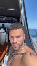 A shirtless man, identified as Jeremiah Brown, enjoys a sunny day on a luxury yacht in Mexico. The video captures scenic views of the coastline and mountains as the boat speeds across the water, leaving a white wake behind. by @findjeremiah with Original Sound by Contains: Yo Voy - Zion Y Lennox (feat. Daddy Yankee)