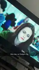 A close-up shot captures a person watching the movie 'Twilight' on a television screen. The scene focuses on the character Bella Swan, played by Kristen Stewart, with a subtitle reading 'Sick day, so Twilight it is.' The image suggests a cozy, relaxed atmosphere perfect for staying home and enjoying a film. by @ken_sutton23 with original sound