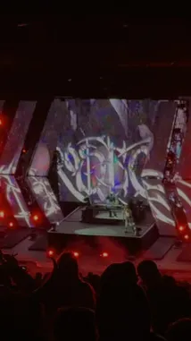 Witness Sasha commanding a massive stage in front of a cheering crowd. The performance features dynamic lighting, a large video wall with abstract visuals, and energetic movements, creating an immersive concert experience. by @squashha with squashha by Original Sound