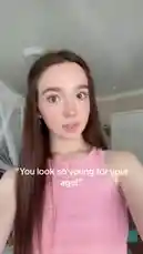 In this short clip, Ruby Jay is seen indoors, reacting to the common compliment 'You look so young for your age.' She smiles and then lets out a series of playful monster roars, creating a humorous and lighthearted moment. by @iamrubyjay with original sound