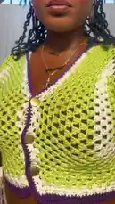 In this stylish lookbook, Darline Iona showcases her vibrant lime green and purple crochet two-piece set. She demonstrates how to style the outfit, including a unique skirt design with dangling chains, and shares her beauty routine with a pink hairbrush. The video offers a behind-the-scenes glimpse into her fashion-forward aesthetic. by @dolledxdoll with original sound