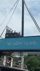 Witness an exhilarating high dive from a towering platform into a lake below. The diver soars through the air before making a splash, watched by spectators on the shore and others enjoying the water. This action-packed moment captures the fun and excitement of a day at a recreational waterfront area. by @digiflips with Original Sound by digiflips