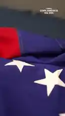 This official promotional video showcases the Colombia national football team ahead of the CONMEBOL Copa América USA 2024™. It features close-ups of the players' new maroon jerseys, the iconic Colombian crest, and individual portraits of key squad members. The athletes are seen in various settings, including a studio with a green screen and a locker room, highlighting their focus and unity as they prepare for the tournament. by @copaamerica with Original Sound by copaamerica