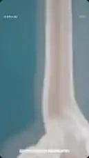 This short-form video offers a close-up, sensory-rich look at a Starbucks beverage. It begins with extreme macro shots of whipped cream being dispensed into a drink, followed by a shot of a brown liquid being poured over it. The sequence concludes with a full reveal of a finished, handheld Starbucks Frappuccino topped with whipped cream and sprinkles. The entire visual experience is paired with a distinct audio track featuring a squishing sound, a sharp crack, and a deep rumble, creating an intriguing and immersive sensory presentation. by @mts550 with Original Sound by mts550