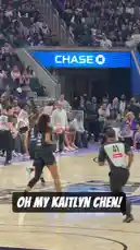 This dynamic video captures WNBA star Sabrina Ionescu in action during a game. She is seen wearing her distinctive black jersey with the number '15' and a white headband, showcasing her athleticism as she drives towards the basket. The crowd is visibly engaged, adding to the electric atmosphere of the professional basketball game. by @wnba with Original Sound by wnba