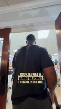 This video captures the energetic atmosphere of a New Orleans Saints rookie welcome event. Players interact warmly with enthusiastic fans, signing autographs for helmets, photos, and other memorabilia. The crowd cheers loudly throughout the meet-and-greet, creating a celebratory and welcoming environment for the team's new talent. by @saints with Original Sound by saints
