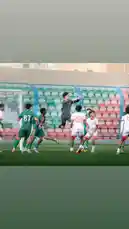 In a thrilling moment from a Saudi Arabian football match, the goalkeeper from Al-Rawda Club leaps into the air to make a dramatic save, showcasing elite reflexes and athleticism. Players in green and white jerseys battle fiercely near the goalpost under bright stadium lights, capturing the raw energy and competitive spirit of local sports. This high-stakes play highlights the skill and determination central to youth and amateur football in Saudi Arabia. by @alrawdahclub with original sound