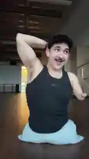 In a spacious dance studio, dancer Timur performs an expressive floor routine. Kneeling on a white cushion, he uses his upper body strength and fluid arm movements to create captivating shapes and gestures. His performance is set to a powerful, rhythmic electronic track, showcasing his unique style and physical control. by @onelimbtim with Original Sound by onelimbtim