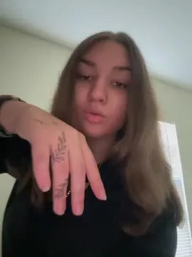 In this personal vlog, Ariki shares a close-up look at her new hand tattoo while discussing her style and daily life. She gestures expressively, showcasing her accessories and relaxed demeanor in a bright indoor setting. by @ms.putdatshiton with Original Sound by Contains: Conceited (There's Something About Remy) - Remy Ma