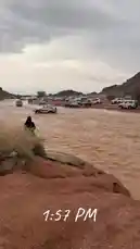 Witness a dramatic off-road expedition as a convoy of SUVs carefully traverses a deep, fast-flowing river. A person in traditional attire observes from the bank, adding a cultural element to this intense natural challenge. This real-time footage captures the raw power of nature and the resilience of adventure travelers. by @karim.alsaleh with karim.alsaleh by Original Sound