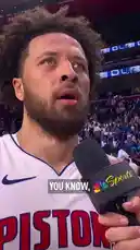 A close-up interview with a Detroit Pistons player immediately after a game. He speaks about protecting home court, learning from a previous series, and the team's focus on winning their next matchup. The player, wearing his white Pistons jersey, addresses the media with a microphone featuring the NBC Sports logo. by @nbapistons with Original Sound by nbapistons