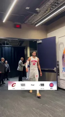 The Detroit Pistons players and staff celebrate their victory in the locker room after defeating the Cleveland Cavaliers. The team walks through the hallway, displaying joy and camaraderie, with the final score of 111-101 displayed on screen. by @nbapistons with Original Sound by nbapistons