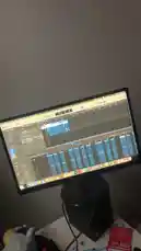 A screen recording of the music production software Logic Pro X, showing a project titled 'Untitled-8-Tracks' being actively worked on. The timeline displays multiple audio tracks with blue waveforms, and the playhead moves across the timeline, indicating real-time playback or editing. This provides a behind-the-scenes look at the digital audio workstation (DAW) process used by the creator. by @nascarfeezy with Original Sound by nascarfeezy
