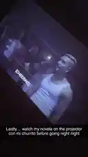 la_kari365 님이 만든 Original Sound 포함 @la_kari365 님이 만든 This short clip captures a moment from Kari's movie night. It starts with a tense scene from a film projected onto a wall, showing a character in distress and text like '[THUDS]'. Suddenly, the camera pans away from the screen to reveal a dark room with a door and a window with blinds, suggesting the movie was playing in her home. The combination of the intense on-screen drama and the mundane reality of the room creates a unique, relatable slice-of-life moment.