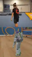 In a split-screen spectacle, parkour athlete Winchumbo performs dynamic flips and rolls on a blue mat, while a Buzz Lightyear character from the Toy Story franchise mimics his movements in a virtual world. The scene transitions to a gym where Winchumbo and another man, identified as Bob Rees, discuss a 'dive roll twisting both directions' trick, suggesting it might be featured in the next Toy Story movie. by @winchumbo with You've Got a Friend in Me (From "Toy Story") by London Music Works & Chuck Colby