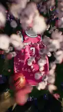 A top-down view captures a vibrant pink Washington Wizards jersey with the number '3' and a Wilson basketball resting amidst lush green grass and blooming purple flowers. Petals gently float across the frame, creating a dreamy, artistic atmosphere that blends sports memorabilia with natural beauty. by @washwizards with original sound
