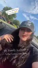 A sunny day adventure captured from the backseat of a convertible. A woman wearing a 'Devilish' cap films herself and her friends as they laugh and enjoy the ride through a suburban area. The open-top car provides a perfect backdrop for their carefree journey. by @e-beth with Original Sound by e-beth