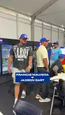 In a candid backstage moment, New York Giants player Francis Mauigoa shares a warm embrace and conversation with fellow athlete Jaxson Dart. The friendly interaction takes place inside a tented area, suggesting a pre-game or event setting. This genuine connection highlights the camaraderie among athletes, providing fans with an intimate glimpse into the personal side of professional sports. by @newyorkgiants with newyorkgiants by Original Sound