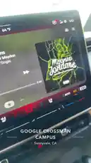 tufavlatiino 님이 만든 Original Sound 포함 @tufavlatiino 님이 만든 This video offers a brief glimpse inside the Google Crossman Campus in Sunnyvale, California. It begins with a close-up of a car's infotainment screen playing the song 'Mejores Jordans' by Mendo & Oscar Maydon, before panning out to reveal the modern glass exterior of the Google building. The scene captures the essence of the tech hub environment.