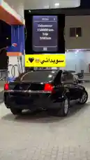 Watch KFL1's sleek black sedan parked at a gas station during the night. This real-time, 1-FPS capture shows the car's rear profile under bright station lights, highlighting its design and dual exhausts. The scene offers a glimpse into a routine moment, perfect for car enthusiasts and those interested in lifestyle content. by @kfl1 with original sound