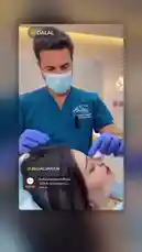 This short-form video features Dr. Fouad Najjar from Bella Clinic performing a non-surgical brow enhancement procedure on a patient. The doctor, dressed in blue scrubs, uses tweezers to carefully shape the patient's eyebrows while providing commentary. The patient shares her positive experience, praising the natural-looking results. The video highlights the clinic's expertise in cosmetic treatments. by @bellaclinickw with Original Sound by bellaclinickw