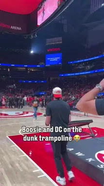 Witness the Atlanta Hawks' pre-game entertainment as rappers Boosie and DC take over the dunk trampoline! This high-energy segment captures their athletic attempts to slam the ball through the hoop, showcasing a unique blend of music and basketball culture in front of a packed crowd. by @atlhawks with Original Sound by atlhawks