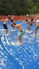Watch Bob Reese attempt hilarious stunts across various locations! From a slippery blue tarp and a giant inflatable water slide to a trampoline park and a daring rope challenge, this compilation features epic fails, impressive jumps, and plenty of laughs. Can he make it down the slide? Will he survive the trampoline? Find out in this action-packed series of challenges. by @bob_reese with Original Sound by bob_reese