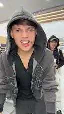 In a bustling airport terminal, S E B A S 🧸 and a friend execute a synchronized dance routine. Dressed in casual hoodies and sweatpants, they perform choreographed moves for the camera amidst waiting passengers and shops. by @twinksebass with Original Sound by Contains: BbY WOW - KAROL G, Judeline, rusowsky