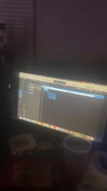 This behind-the-scenes look at Da First Option ⚡️'s creative process reveals his music production setup in Apple's Logic Pro X. The screen recording captures him actively arranging blue MIDI clips on a piano roll, demonstrating his technique for composing electronic beats. A clear view of the software's interface, including audio tracks and a timeline, provides insight into his workflow as he builds a track layer by layer. by @nascarfeezy with Original Sound by nascarfeezy