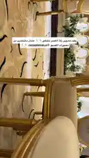 This point-of-view video offers a tour of a wedding hall's interior, focusing on the elegant gold chairs and patterned carpeting. The perspective shifts from looking down the aisle to a close-up of a person's hand giving a thumbs-up gesture, suggesting approval of the venue. by @me_ha73 with Original Sound by me_ha73