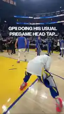Witness Golden State Warriors star Steph Curry performing his pregame routine. In a playful moment before the game, he executes a unique head tap trick, getting a little help from a teammate to complete a dunk. It's a fun, behind-the-scenes look at Curry's pregame energy and team camaraderie. by @warriors with Original Sound by warriors