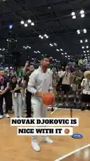 Watch an NBA player demonstrate his impressive ball-handling and shooting skills during a fan engagement event. Dressed in all-white athletic wear, he performs a series of dribbles and makes successful shots on a full-sized hoop inside a large convention hall. Surrounded by fans and media, the player showcases his talent in a lively atmosphere, highlighting the excitement of live sports events. by @nba with Original Sound by nba